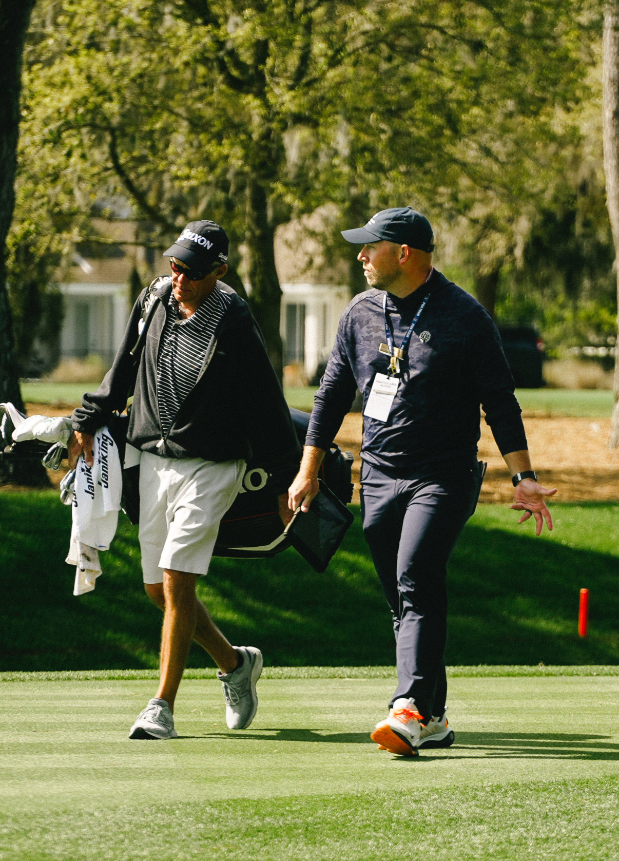 Cory Jez walking the course with a PGA Tour player